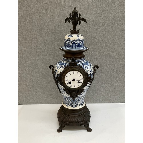 7027 - A modern Dutch style vase form clock with Roman dial, 56cm tall x 23cm wide, with pendulum