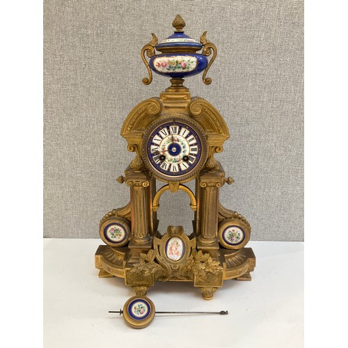 7028 - A 19th Century French ormolu mantel clock of Architectural form with Sevres style porcelain face pan... 