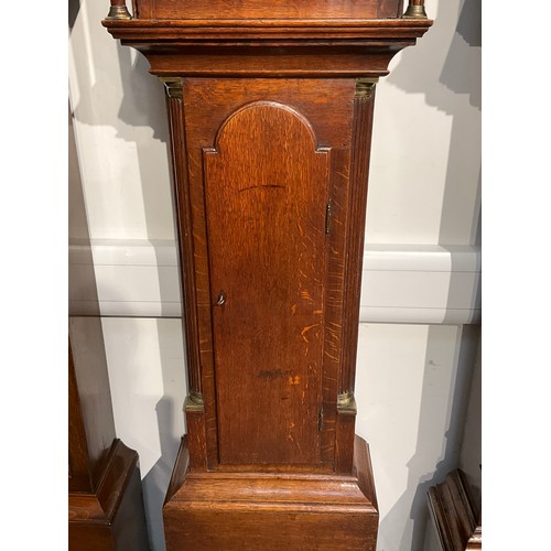 7041 - A Georgian country oak long case clock with painted arch dial, scene of country house, face inscribe... 