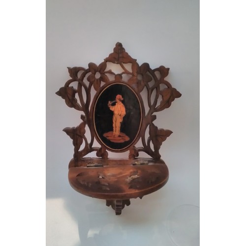 7317 - A 19th Century fretwork miniature wall bracket with base metal travel clock, glass loose