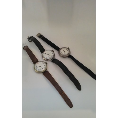 7310 - Three vintage silver cased gentleman's wristwatches in the trench style