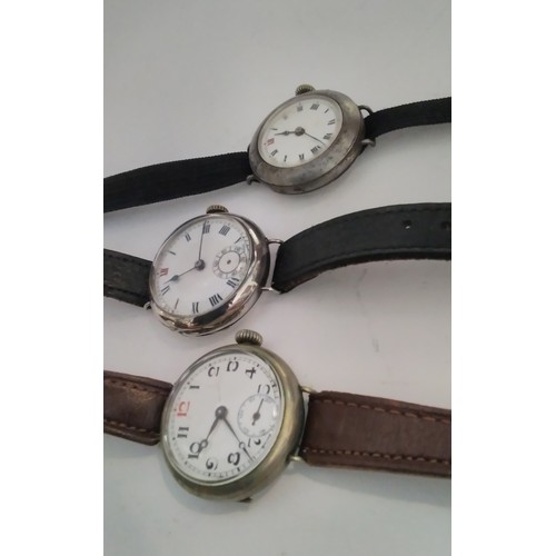 7310 - Three vintage silver cased gentleman's wristwatches in the trench style