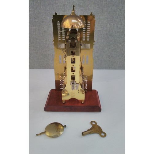 7280 - An ecclesiastical style cathedral design novelty mantel clock with key and pendulum