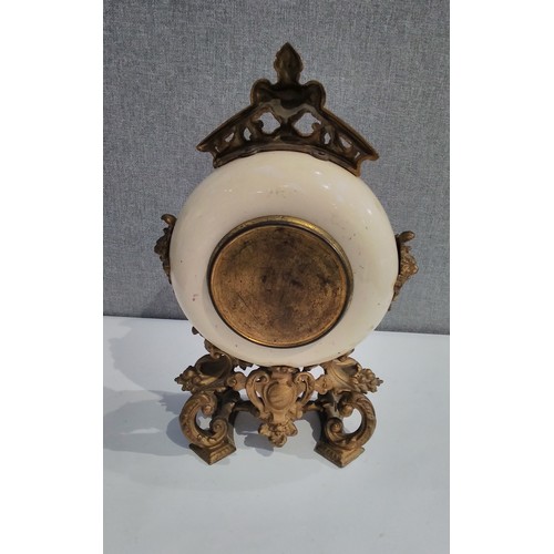 7288 - A French ceramic and ormolu mantel clock, Arabic dial, thistle decoration, 38cm tall