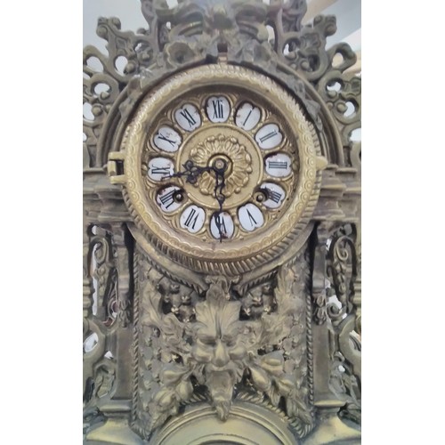 7290 - A 20th Century heavy cast brass mantel clock with scrolled detail