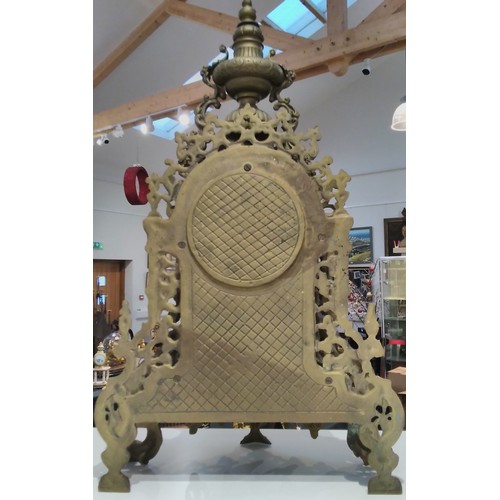 7290 - A 20th Century heavy cast brass mantel clock with scrolled detail