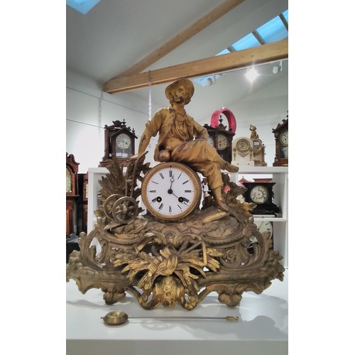 7291 - A French Ormolu figural clock, seated gent harvest design, bronze medal movement, 39cm tall x 39cm, ... 