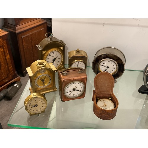 7224 - A quantity of travelling clocks including copper cased and Astral