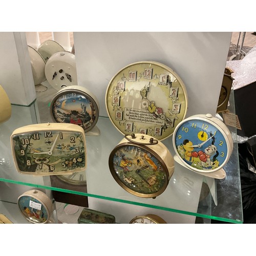 7214 - Five mid century pictorial alarm clocks including Smiths Sooty and Sweep, and Hare and Tortoise