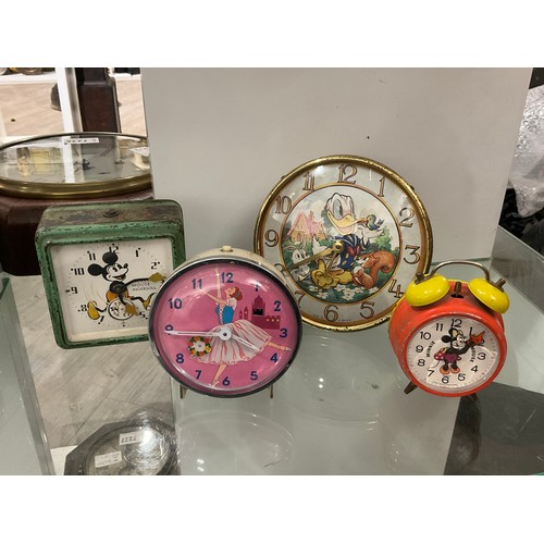 7217 - Four mid century pictorial alarm clocks, three Disney themed including Mickey, Minnie and Donald