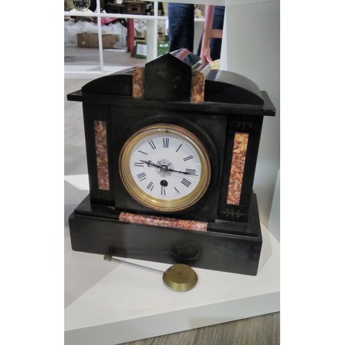 7307 - A circa 1900 black slate and marble mantel clock with Roman dial, architectural form, with pendulum