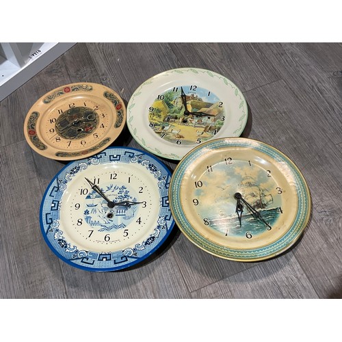 7210 - Seven 20th Century tinplate clocks including Smiths