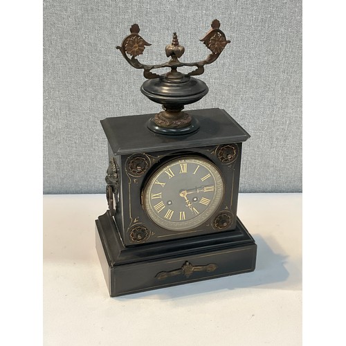 7082 - A late 19th Century black Belgian marble mantel clock surmounted by an urn with lion mask handles, e... 