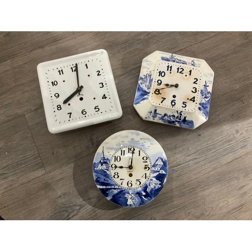 7274 - Five Continental ceramic wall clocks, two in blue and white including Dutch mill scene, Arabic dials