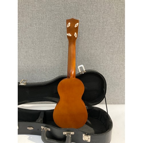 5100 - A Mahalo ukulele of guitar form with fitted hard case