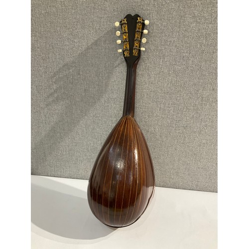 5111 - A George Morley of London retailed round back mandolin with tortoiseshell effect guard, segmented ba... 