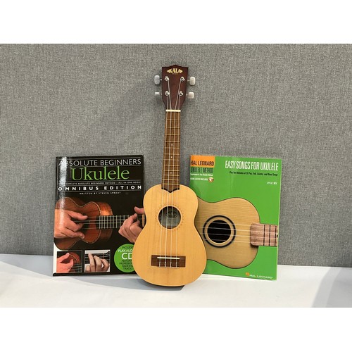 5099 - A Kala KA-15S-S ukulele with two tuition books