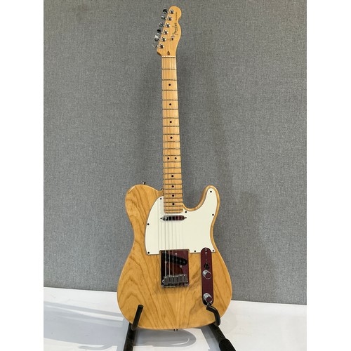 5106 - A Fender American Series Telecaster in natural ash, serial number Z1032582, maple neck, Fender hard ... 