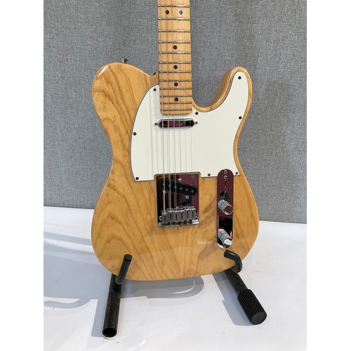 5106 - A Fender American Series Telecaster in natural ash, serial number Z1032582, maple neck, Fender hard ... 