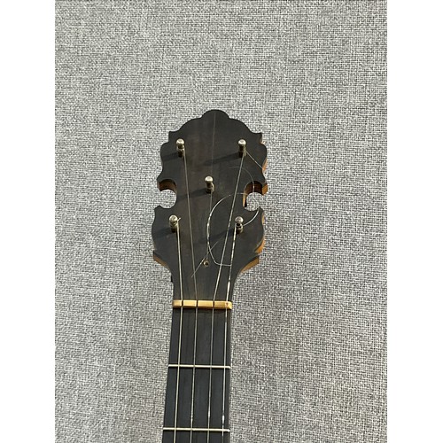 5003 - An early 20th Century five string banjo, closed back, damage to skin, some lifting to back, with har... 