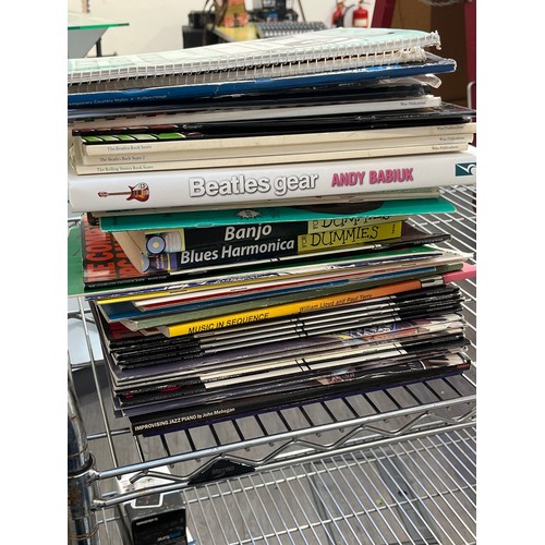 5070 - Two boxes of mixed music equipment including software, Boss TU-12S tuner, Shure headphones and mixed... 