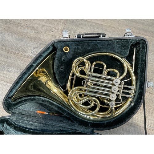 5124 - A Yamaha French horn, brass, model YHR667, some indentations and wear, with fitted Yamaha hard case