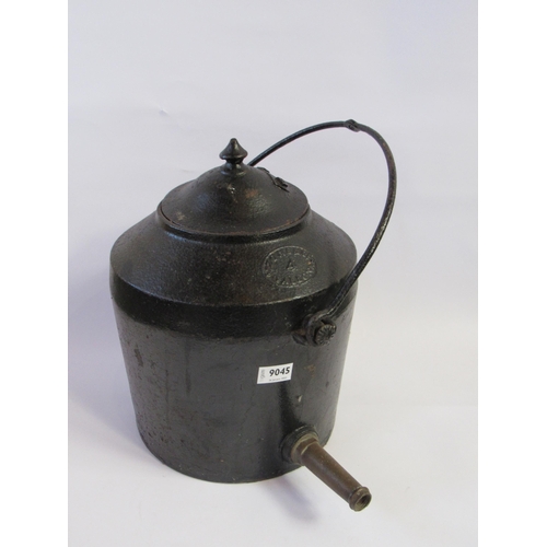 9045 - A cast iron four gallon kettle with hanger and brass spout               (E) £20-30