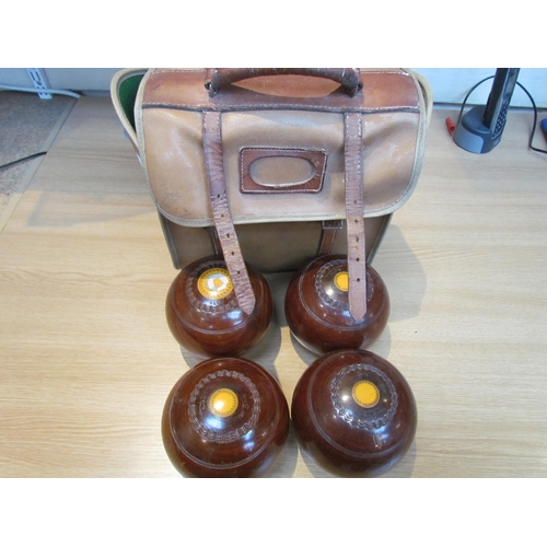 9204 - Four cased Thomas Taylor, Glasgow wooden lawn bowls