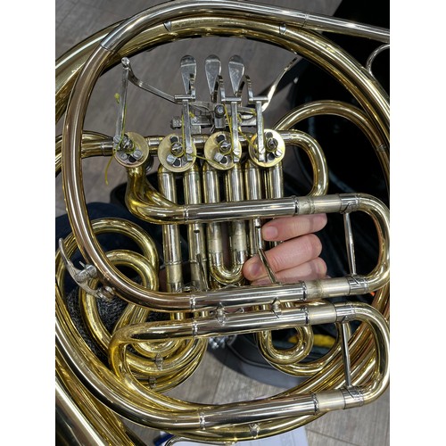 5124 - A Yamaha French horn, brass, model YHR667, some indentations and wear, with fitted Yamaha hard case