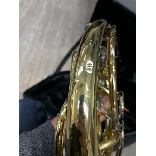 5124 - A Yamaha French horn, brass, model YHR667, some indentations and wear, with fitted Yamaha hard case