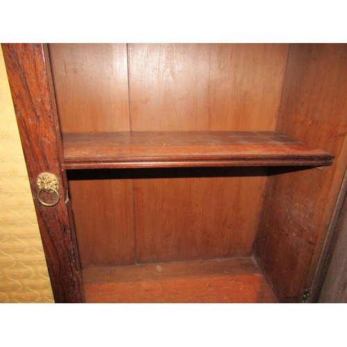 1017 - A 19th Century rosewood chiffonier, the raised gallery back set with single shelf supported by spind... 