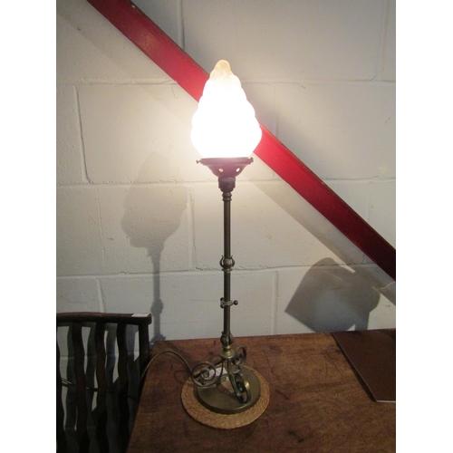 1003 - A brass table lamp base with torch form glass shade