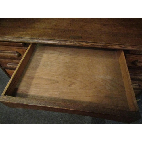 1013 - A Circa 1900 oak roll top desk with key, 119cm high x 125cm wide x 75cm deep