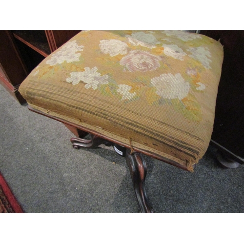 1020 - A Victorian adjustable piano stool with needlepoint top over fluted and scrolled tripod support  (E)... 