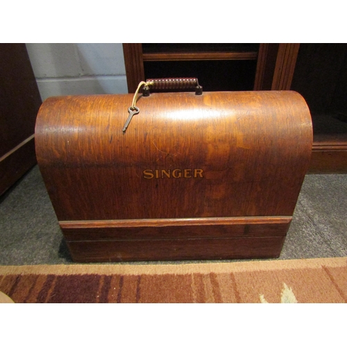 1027 - A singer sewing machine 'EB855264' with original wooden case and accessories