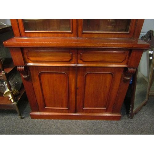 1038 - A Victorian mahogany bookcase, two drawer over two door base, missing some veneer, 226cm high x 107c... 