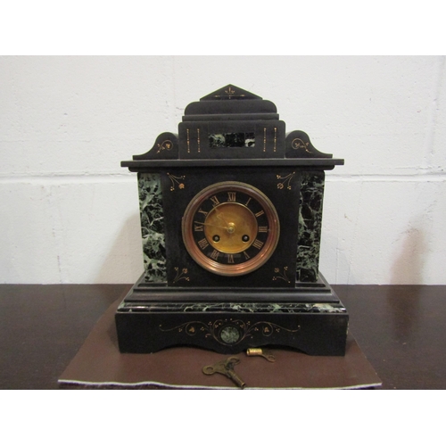 1059 - A Victorian black slate and marble mantel clock of architectural form, Roman numerated dial, enriche... 