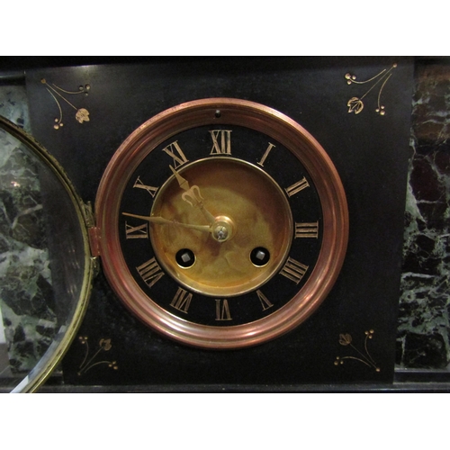 1059 - A Victorian black slate and marble mantel clock of architectural form, Roman numerated dial, enriche... 