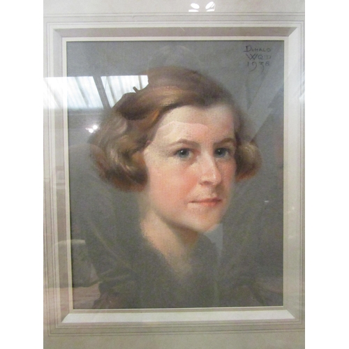 1093 - DONALD WOOD (1889-1953): A pastel portrait of a lady, signed and dated upper-right 1938, framed and ... 