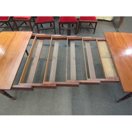 1135 - A Victorian extending dining table with three extra leaves on turned legs to castors, 73cm high x 26... 