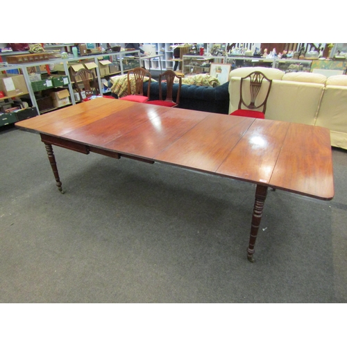 1135 - A Victorian extending dining table with three extra leaves on turned legs to castors, 73cm high x 26... 