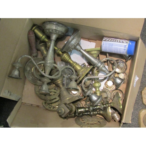 1140 - A box containing assorted brass and metal candlesticks, horse brasses and trivet etc.