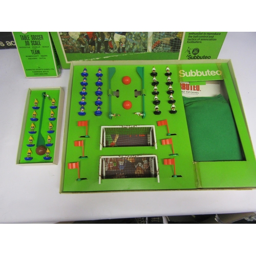 7077 - A boxed 1970's Subbuteo table football team, ref.47 in yellow shirts and blue shorts, a Subbuteo Clu... 