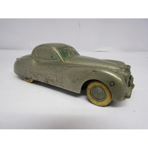 7096 - A playworn Prameta Kolner Automodelle Jaguar XK 120 diecast metal clockwork car, missing key