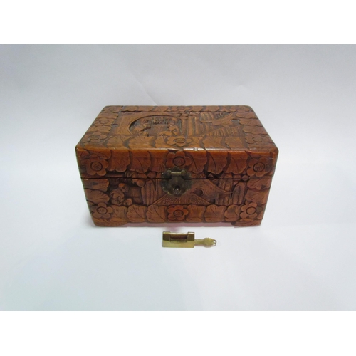 1450 - A Chinese camphor wood carved trinket box with brass locking mechanism