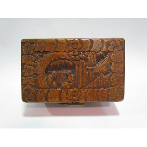 1450 - A Chinese camphor wood carved trinket box with brass locking mechanism