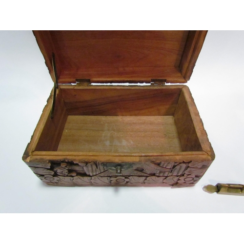 1450 - A Chinese camphor wood carved trinket box with brass locking mechanism