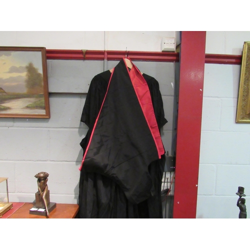 1049 - A Shepherd & Woodward Ltd., Oxford quality scholastic gown, a soft cloth mortar board and scholastic... 