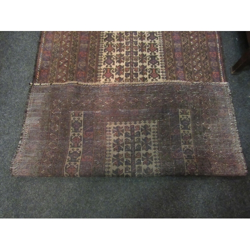 1061 - A red ground geometric design rug with multiple borders, 140cm x 90cm