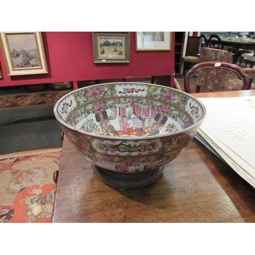 1094 - A 20th Century Chinese Famille Rose pattern table centrepiece bowl with panels of figures and floral... 